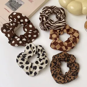 Autumn leopard and dot pattern scrunchies set on elegant minimalist background