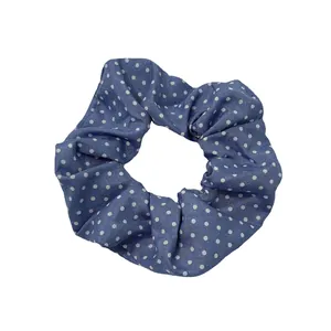 Classic ocean blue polka dot scrunchie with durable cotton texture on white background