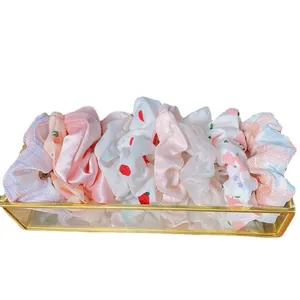 Set di elastici per capelli pastello con motivi floreali, a quadretti e in raso