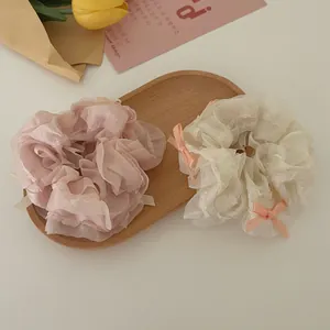 Lace organza scrunchies with bow tie in pink and cream beige colors for hair styling