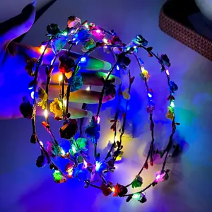 Detail of colorful LED flower headband with glowing lights and silk roses for festivals