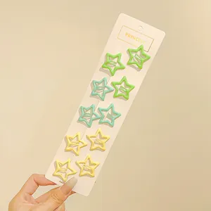 Detalle de 10 pinzas para el cabello con forma de estrella en colores de macaron