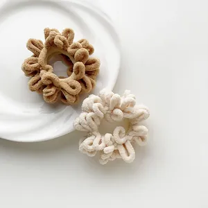 Plush faux fur hair scrunchies in khaki and cream white for cozy autumn styling