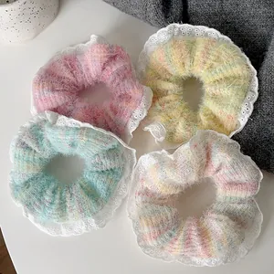Plush wool scrunchies with white lace edges and pearl details in assorted pastel colors
