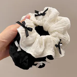 Spitzen-Haargummi-Set mit Schleifen und Perlen in Schwarz und Weiß für elegantes Styling