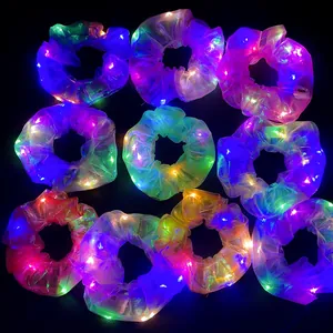 Luminous LED hair scrunchies in multiple colors with glowing neon effect in the dark