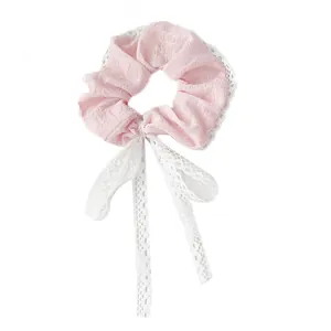 Elegant pink lace scrunchie with white floral ribbon detail for women's hairstyles