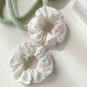 Floral print scrunchies set in pink and blue for ponytail and bun hairstyles