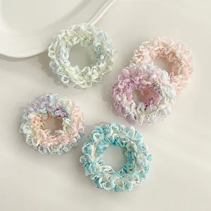 Lot de cinq chouchous en tricot aux couleurs pastel et nuances douces de macaron