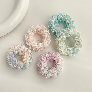 Lot de cinq chouchous en tissu éponge duveteux aux couleurs pastel de bonbons doux