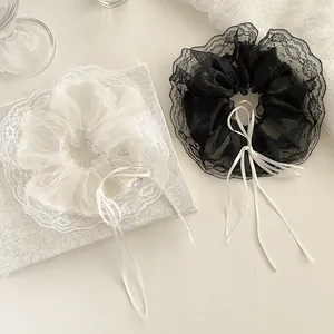Elegant lace organza scrunchies set in black and white with delicate ribbon bows