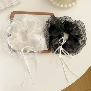 Elegant set of black and white mesh lace scrunchies with sweet ribbon bow details