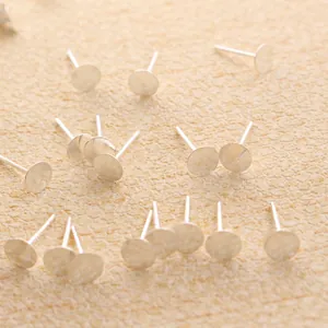 Macro detail of S925 sterling silver flat pad ear studs for DIY jewelry making