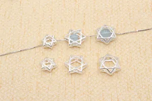 Macro view of S925 sterling silver hollow hexagram beads for DIY jewelry making