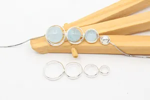 Detailed view of S925 sterling silver hollow round bead frames in four various sizes