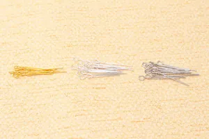 Detailed view of silver, gold, and platinum plated S925 eye pins for jewelry making