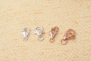 Macro shot of silver and rose gold lobster clasps for DIY jewelry making and necklaces