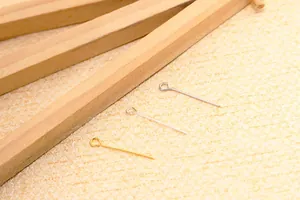 Detail view of gold and silver S925 eye pins for DIY jewelry making and beading