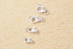 Detailed view of four 925 sterling silver lobster clasps for DIY jewelry making