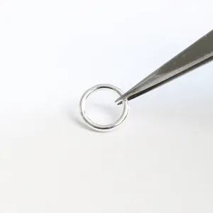 S925 sterling silver closed jump rings for DIY jewelry making held by tweezers