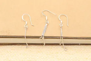 Detailed view of silver S925 sterling silver earring hooks and DIY connector chains