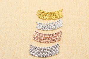 Macro detail of S925 sterling silver curved noodle beads in gold, silver, and rose gold