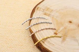 Detailed view of four colorful curved S925 silver tubes with spiral texture for DIY jewelry