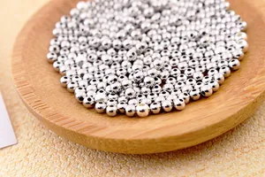 Macro shot of polished S925 sterling silver round spacer beads for DIY jewelry making
