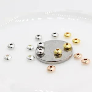DIY saucer-shaped metal spacer beads in gold silver and rose gold shown with coin scale