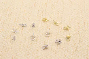 Close-up of S925 sterling silver pearl cup pin bails in gold and silver for jewelry DIY