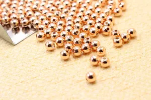 Macro shot of rose gold plated 925 sterling silver loose round beads for DIY jewelry