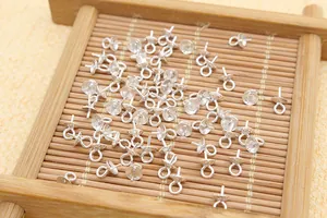Macro view of S925 silver pearl cup pendants with pins for DIY jewelry making
