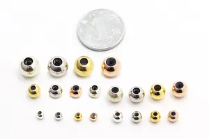 Macro view of S925 sterling silver slider beads in multiple sizes and metallic colors