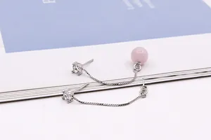 Detail view of S925 silver tassel earring with pink crystal bead and zircon stones