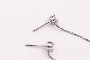 Close-up of S925 sterling silver hallmark on zircon stud earring with box chain
