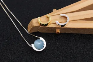 Detail of S925 sterling silver semi-circle bead frame with light blue pearl inlay
