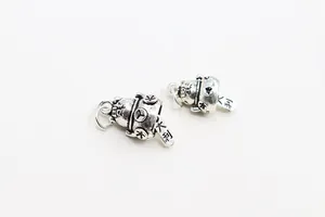 Detailed view of vintage S925 silver Maneki Neko charms with Fu and Dali lucky engravings