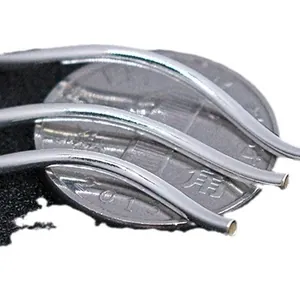 S925 sterling silver S-shaped curved tubes for jewelry making shown with a coin