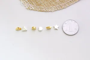 Detailed close-up of S925 sterling silver geometric beads showing the S925 hallmark