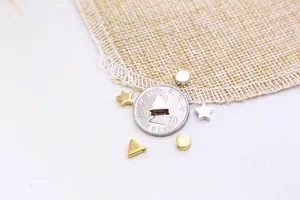 Macro shot of S925 sterling silver geometric star and triangle beads for DIY jewelry