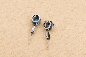 Macro view of S925 sterling silver earring hook with vintage oxidized finish and stamp