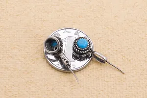 Close-up of S925 sterling silver vintage earrings with turquoise beads and rope texture
