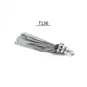 Detailed close-up of S925 sterling silver box chain tassel pendant with engraved metal cap