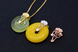 Macro detail of S925 sterling silver cloud pendant clips in gold and rose gold finishes