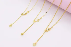 Close-up of S925 silver gold chains with heart charms and adjustable slide beads