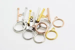 Macro shot of polished S925 silver OT toggles for DIY jewelry in gold and rose gold