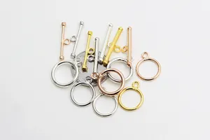 Detailed macro view of S925 sterling silver OT toggle clasps with size reference coin