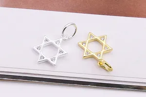 Macro view of gold and silver S925 sterling silver hexagram pendants with micro-set zircons