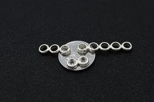 Macro view of S925 sterling silver multi-hole connectors for DIY jewelry making