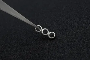 Close-up of S925 sterling silver three-ring connector for DIY jewelry making
